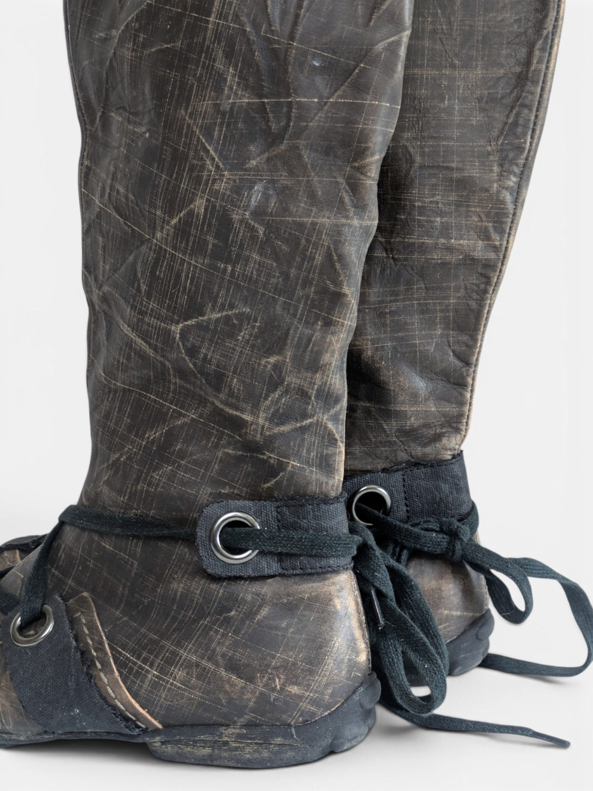 Industrial avant-garde knee-high leather boots